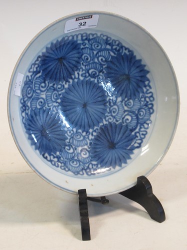 Lot 32 - A Chinese provincial blue and white saucer...