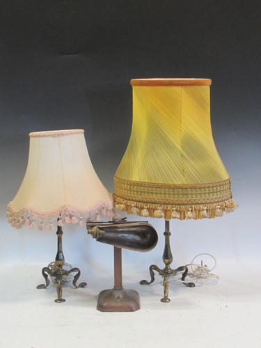 Lot 595 - A pair of brass lamps with tripod bases and a...