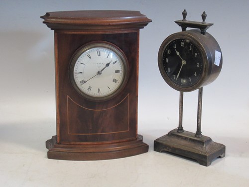 Lot 142 - An Edwardian clock in a mahogany shaped case...