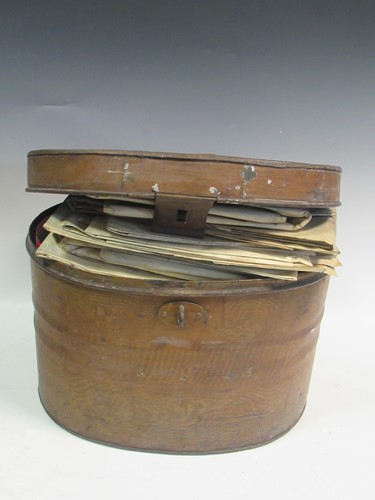 Lot 93 - A desk top writing slope, an oval tin hat box...