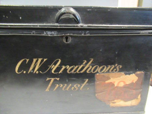 Lot 93 - A desk top writing slope, an oval tin hat box...