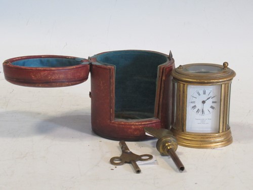 Lot 126 - A miniature oval carriage clock (A/F), with...