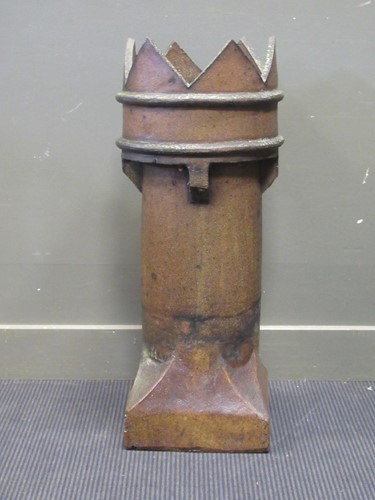 Lot 619 - A saltglaze chimney pot with crown top 86cm high