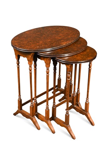 Lot 490 - A nest of three burrwood and mahogany occasional tables, 20th century