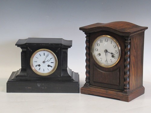 Lot 138 - An oak 8-day mantle clock and a slate mantle...