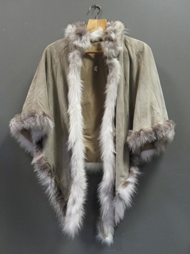 Lot 150 - A suede cape with fur trim, together with a...