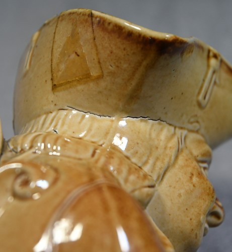 Lot 183 - A Brampton salt glazed Toby jug and lid, circa 1840