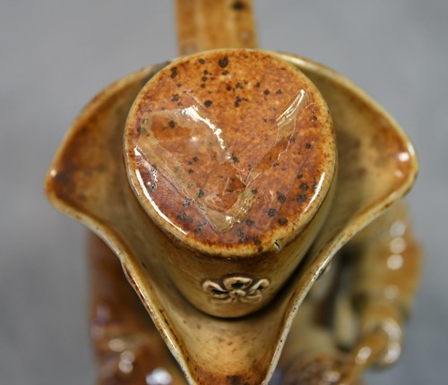 Lot 183 - A Brampton salt glazed Toby jug and lid, circa 1840
