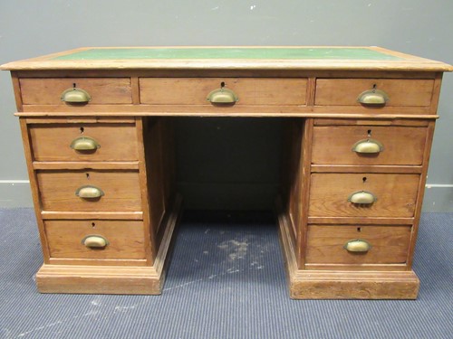 Lot 576 - A pine pedestal desk comprising of nine...
