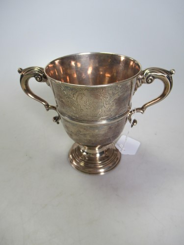 Lot 230 - An Irish silver cup with armorial engraving,...