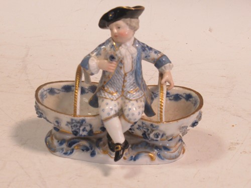 Lot 103 - A Meissen sweetmeat figural basket, crossed...