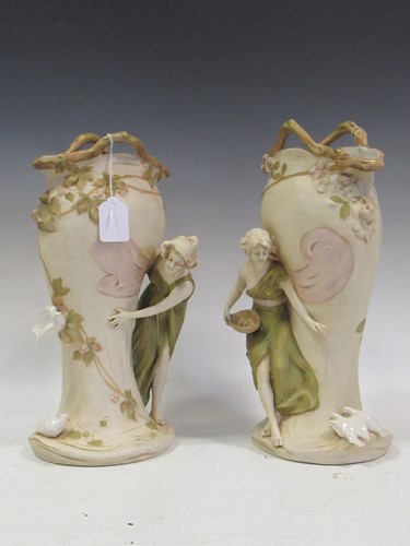 Lot 103A - A pair of Royal Dux figural vases, applied...