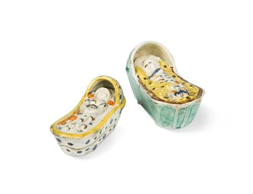 Lot 155 - Two Prattware cradles with a sleeping child, circa 1800