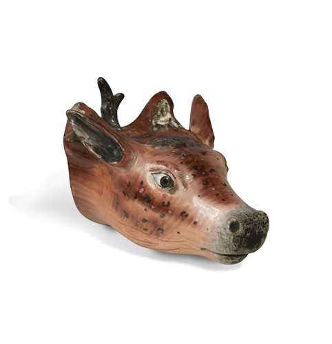 Lot 222 - A late 18th century pearlware stag's head stirrup cup