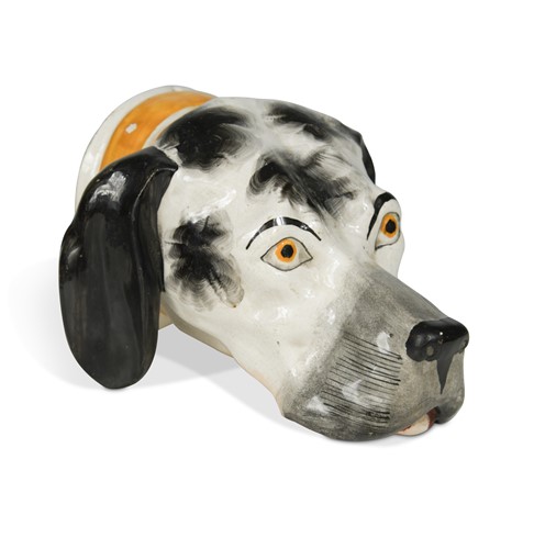 Lot 219 - A pottery hound heads stirrup cup, circa 1820