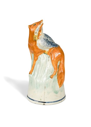 Lot 223 - A rare Staffordshire creamware stirrup cup