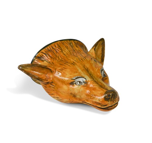 Lot 214 - An early Staffordshire pearlware fox head stirrup cup, 19th century