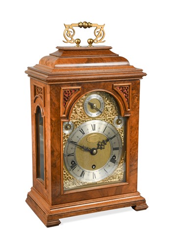 Lot 414 - A 20th century reproduction walnut bracket clock by Elliott, London