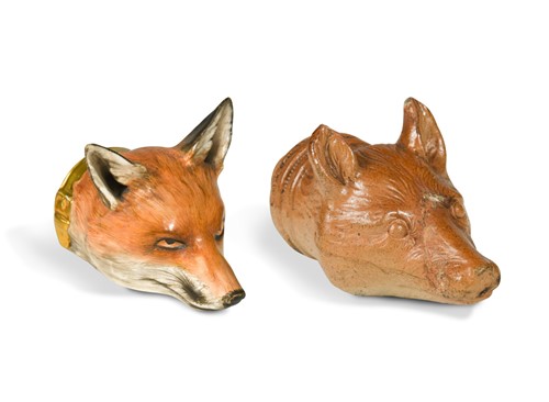 Lot 215 - A Staffordshire pottery fox head stirrup cup, 19th century