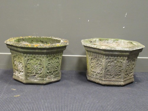 Lot 623 - A pair of composite stone octagonal planters...