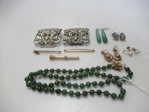 Lot 162 - A necklace of nephrite jade beads with a...