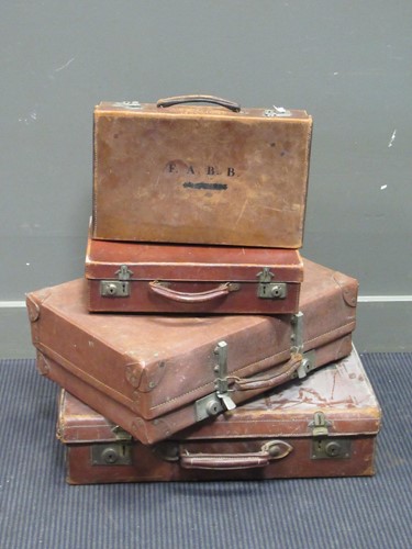 Lot 583 - Two leather trunks and two leather briefcases (4)