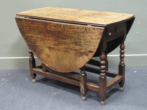 Lot 497 - A 19th century oak gateleg table with single...