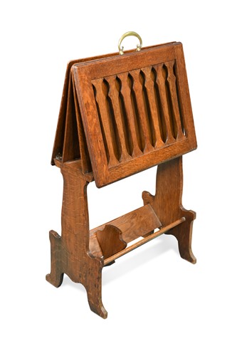 Lot 218 - Liberty & Co., an Arts & Crafts oak 'Caxton' magazine rack, circa 1904