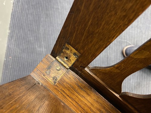 Lot 218 - Liberty & Co., an Arts & Crafts oak 'Caxton' magazine rack, circa 1904