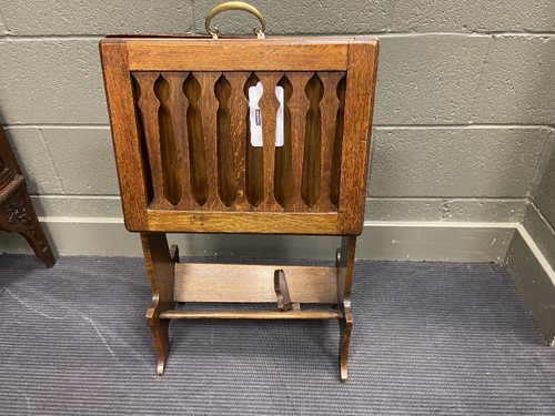 Lot 218 - Liberty & Co., an Arts & Crafts oak 'Caxton' magazine rack, circa 1904