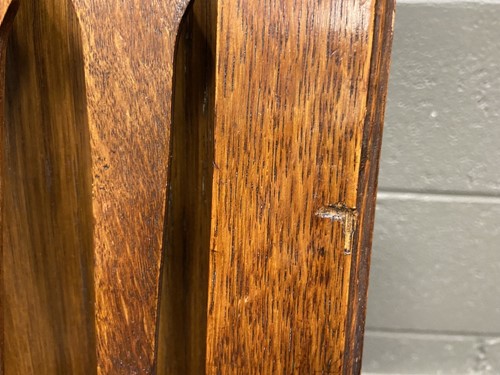 Lot 218 - Liberty & Co., an Arts & Crafts oak 'Caxton' magazine rack, circa 1904
