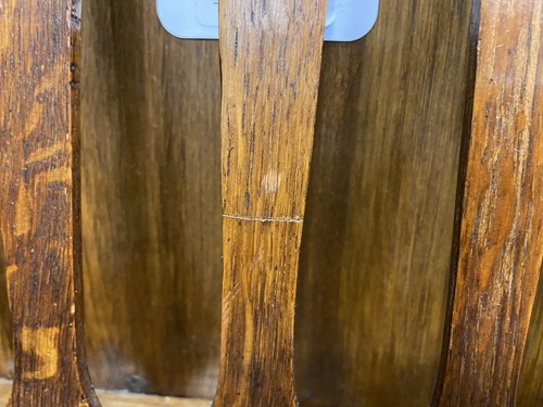 Lot 218 - Liberty & Co., an Arts & Crafts oak 'Caxton' magazine rack, circa 1904