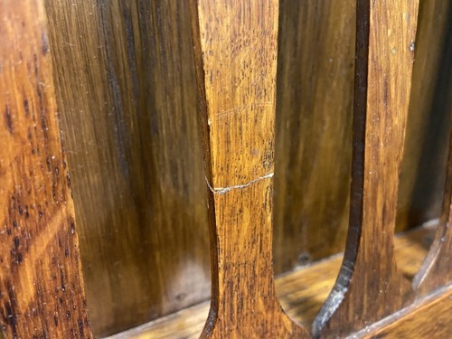 Lot 218 - Liberty & Co., an Arts & Crafts oak 'Caxton' magazine rack, circa 1904