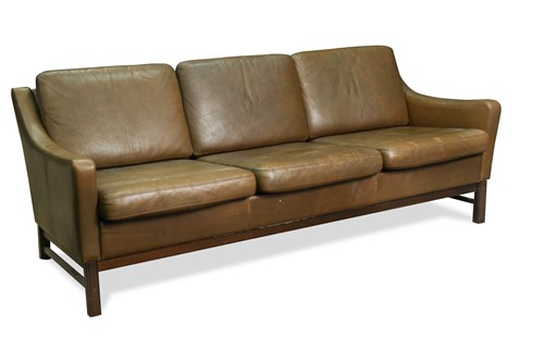 Lot 293 - A modern brown leather three-seat sofa