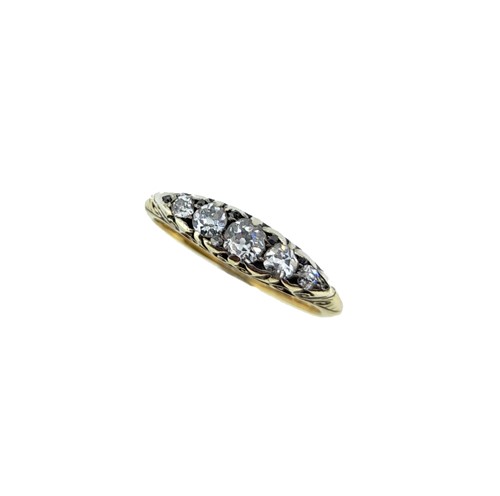 Lot 92 - A diamond carved head half hoop ring