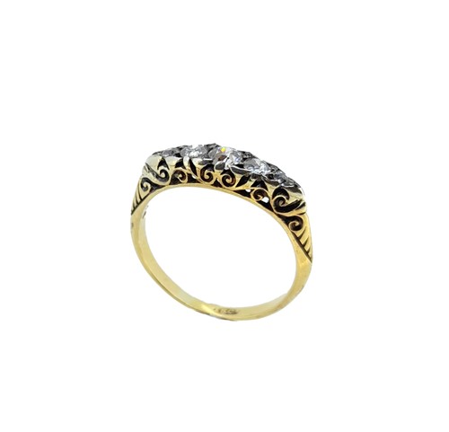Lot 180 - A diamond carved head half hoop ring,...
