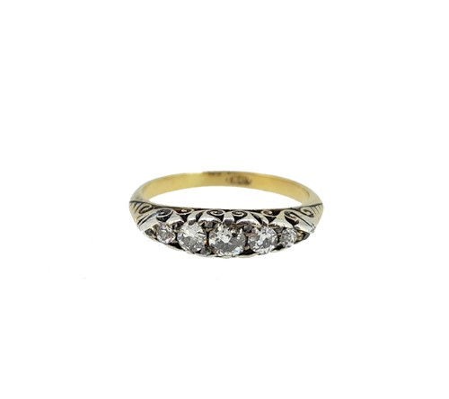 Lot 180 - A diamond carved head half hoop ring,...