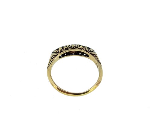 Lot 180 - A diamond carved head half hoop ring,...
