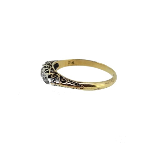 Lot 180 - A diamond carved head half hoop ring,...