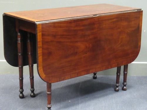 Lot 483 - A George VI mahogany drop leaf table with...