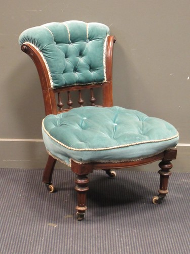 Lot 513 - A Victorian nursing chair upholstered in green...