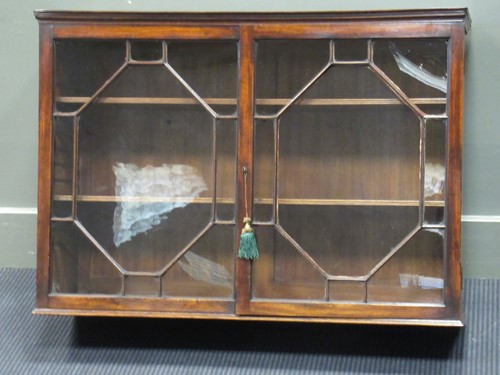 Lot 488 - An early George III mahogany wall hanging...