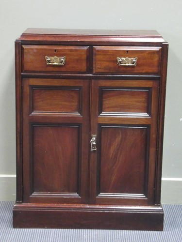 Lot 580 - A late Victorian mahogany narrow cabinet, the...