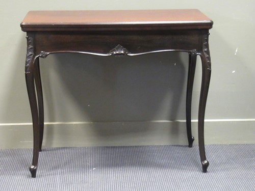 Lot 386 - A late Victorian mahogany fold over swivel top...