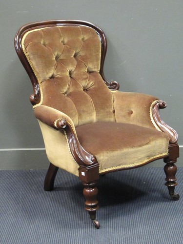 Lot 558 - A mid-Victorian mahogany button back scroll...