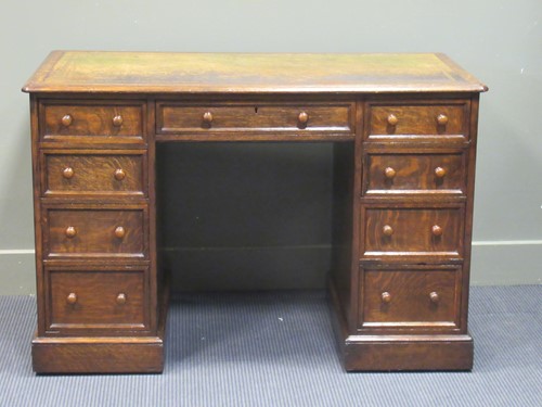 Lot 490 - A late Victorian oak twin pedestal writing...