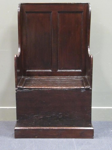 Lot 475 - An 18th century hall settle the panelled back...