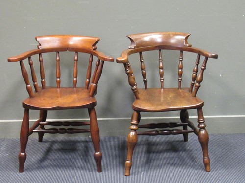 Lot 505 - Two 19th century elm seat broad arm captain...