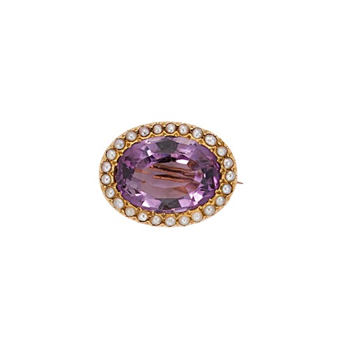 Lot 65 - A Victorian amethyst and seed pearl target brooch