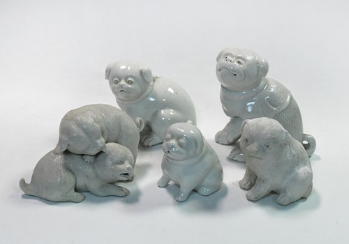 Lot 72 - A group of five Japanese porcelain puppy and puppy groups, 19th/20th century